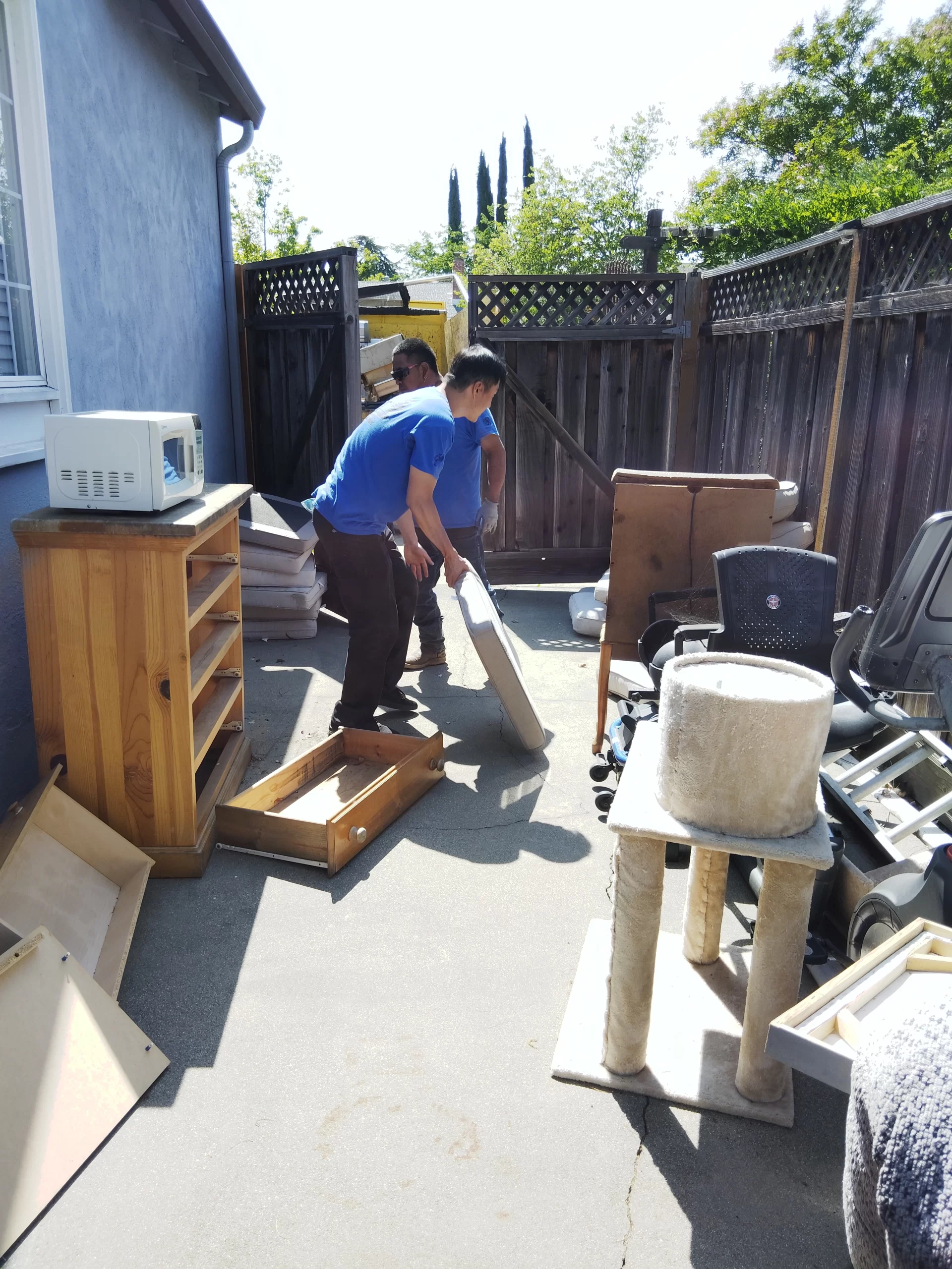 Junk removal crew loading items in San Jose